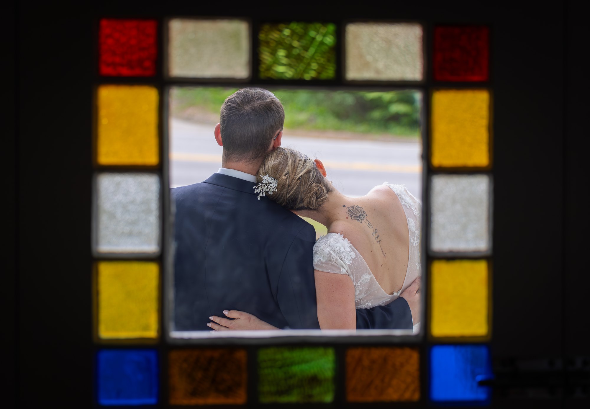 Couple framed by stained glass — Ben Flanders Photography